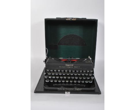 A vintage early 20th Century British made Imperial Good Companion Model T portable typewriter with case