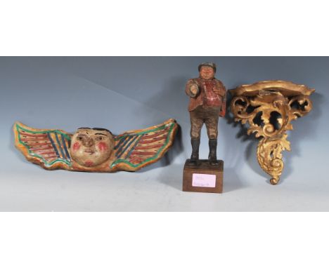 A group of antique treen wooden carved ornamental items dating from the 19th Century onwards to include a carved gilt wood sh