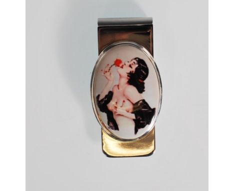 A silver paper / money clip having a central oval enamel panel depicting semi nude lady kissing a flower. Stamped sterling to