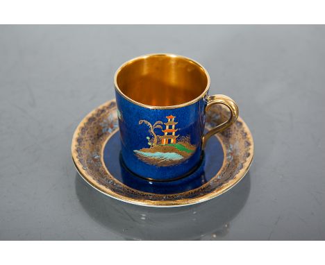 SIX CARLTON COFFEE CANS AND SIX SAUCERS 
decorated in enamel and gilt with Chinoiserie design, on a powder blue ground (12) 
