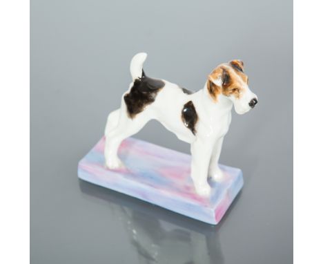 ROYAL WORCESTER TERRIER FIGURE
modelled by Doris Lindner (1896 - 1979) as an alert fox terrier standing on a purple and blue 