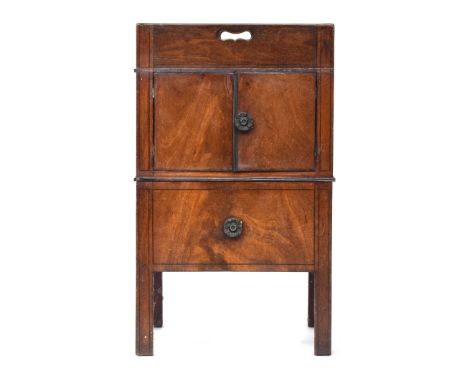 A Regency mahogany night stand, galleried top with pierced handles to all sides, over cupboard doors and pull out commode dra
