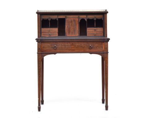 A Victorian ladies writing desk, the galleried superstructure with an arrangement of drawers and pigeon hole, over a crossban