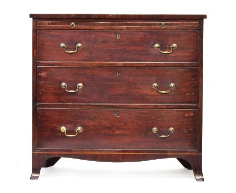 A Regency mahogany bachelor's chest, the plain top over brushing slide and three cockbeaded graduating drawers, on shaped apr