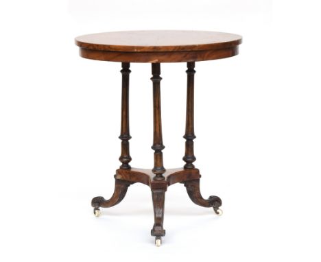 A 19th century pollard oak veneer circular occasional table, raised on three reeded turned supports on triform base and ceram