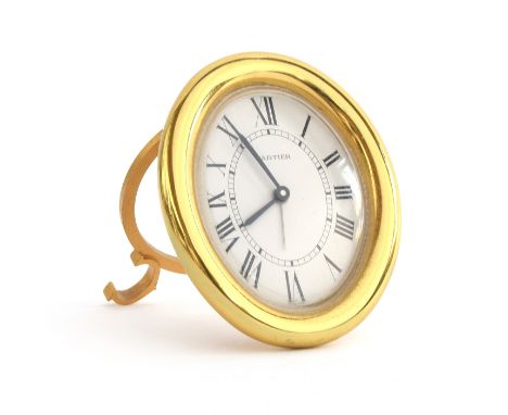 A Cartier desk clock, the oval gold plated desk clock with quartz movement, white dial with Roman numerals, no. 890810362 , 9