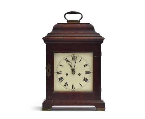 An oak cased mantel clock, moulded pediment, white enamel dial with Roman numerals and outer minute track, on bracket feet wi