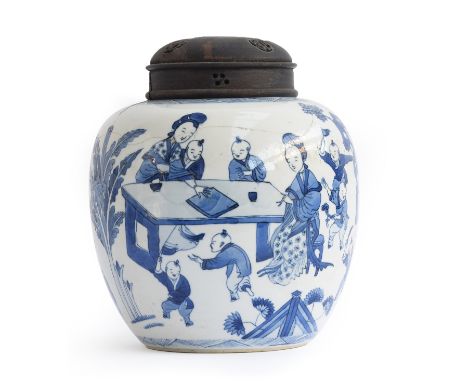 A large Chinese Kangxi style blue and white ginger jar, depicting women and children playing around tables, the scene separat