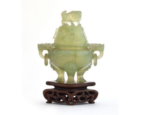 A Chinese carved jade lidded censer on a carved hardwood stand, with foo dog finial, dragon masks and loop handles, 12cmH exc