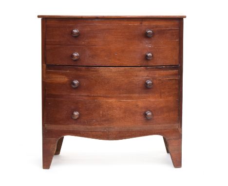 A small Regency mahogany bowfront commode, in original condition, the hinged top opening to reveal turned cover and original 
