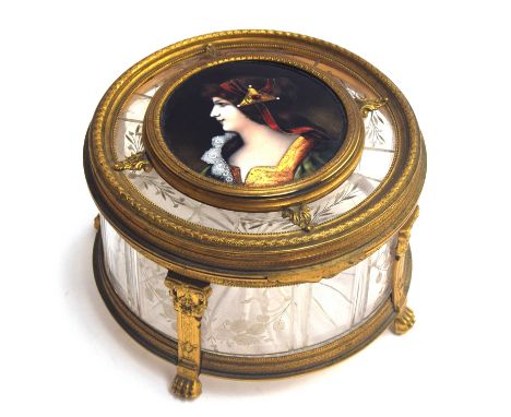 A French circular ormolu mounted crystal casket, the lid with hand painted enamel plaque depicting a woman, her headpiece set