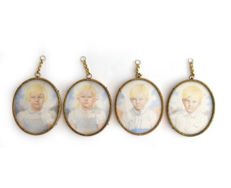 A set of four early 20th century watercolour and pencil miniatures of blonde children, in gilt metal oval frames with convex 