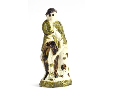 An Astbury-Whieldon figure of a man, c.1745, bears label for the 'L. J Wickes Collection', 13cmH 