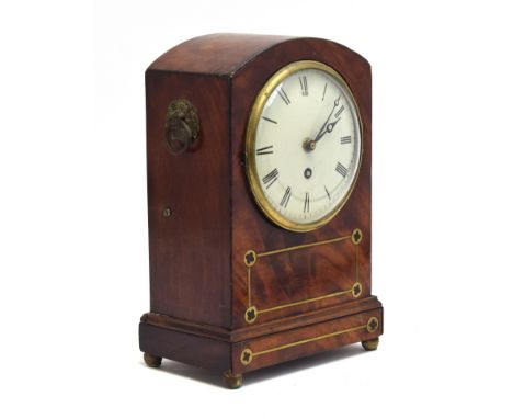 A mahogany and brass inlaid mantel clock, Roman numerals to white enamel dial, on brass ball feet, 32cm high 