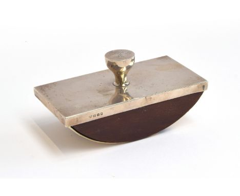 A silver and mahogany desk blotter by Goldsmiths &amp; Silversmiths Co Ltd, Birmingham 1927, rectangular with simple knop han