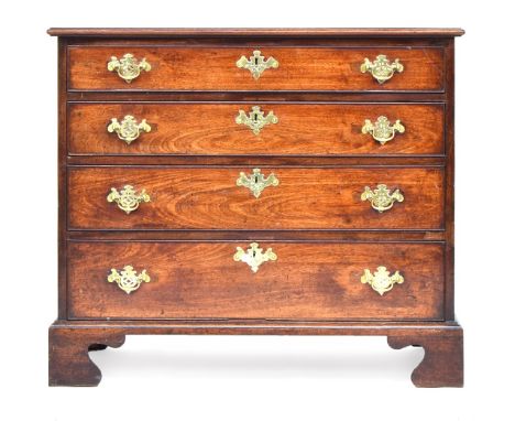 A late George III mahogany chest of drawers, the rectangular moulded top above four graduated drawers with pierced brass hand