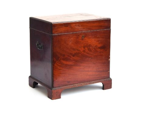 A Regency mahogany cellarette, of rectangular form, with twin brass carry handles, on bracket feet, the interior divided into