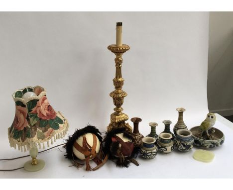 A mixed lot of Continental studio pottery, ostrich eggs, an altar style lamp base, etc 