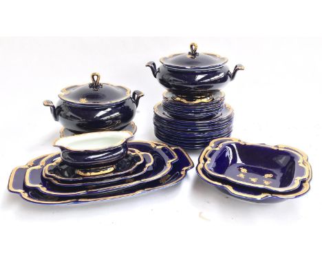 A blue and gilt 26 piece part dinner service, marked Berlin, some af, to include plates, side plates, tureens etc Purchased i