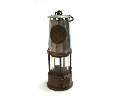 An original Davy lamp with plaque reading ' The Protector Lamp and Lighting Co. Ltd Eccles, type GR.6, Ministry of Power safe
