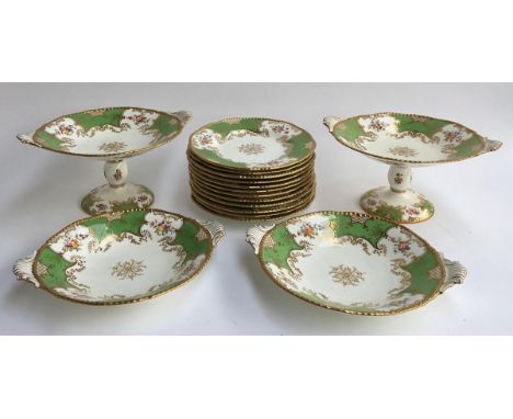 A Coalport green and gilt part dinner service to include several cake stands and a number of side plates 