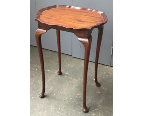 A walnut lamp table with pie crust edge, 70cmH 