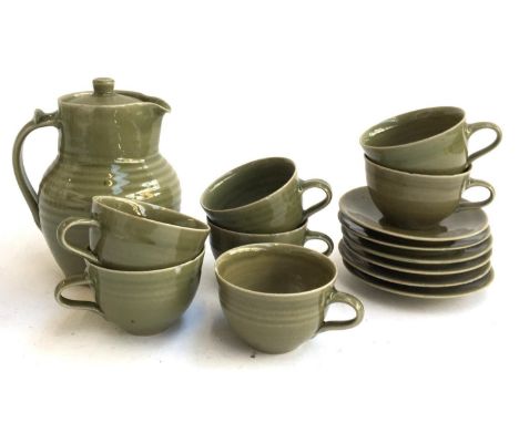 A stoneware coffee set comprising cups (7), saucers (6) and coffee pot 