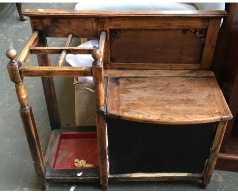 A 20th century oak hall seat and stick stand, with undershelf 