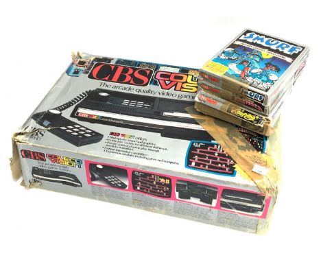 A CBS Coleco Vision early gaming console, with four games: Smurfs; Cosmic Avenger; Looping and Cabbage Patch Kids 