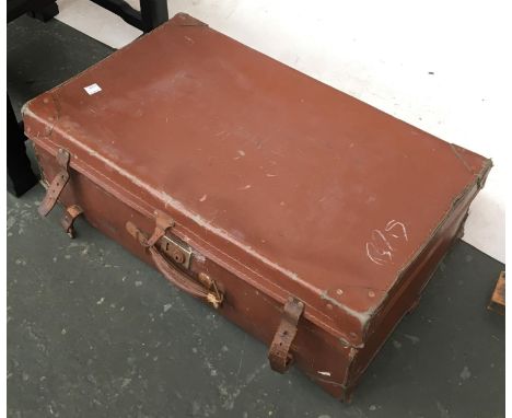 A vintage leather suitcase, containing a quantity of ceramics and a table lamp 