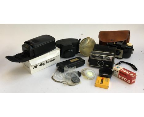 A Kodak Brownie 127 together with Kodak instamatic 104; together with a number of accessories and filters; flash unit; Minolt