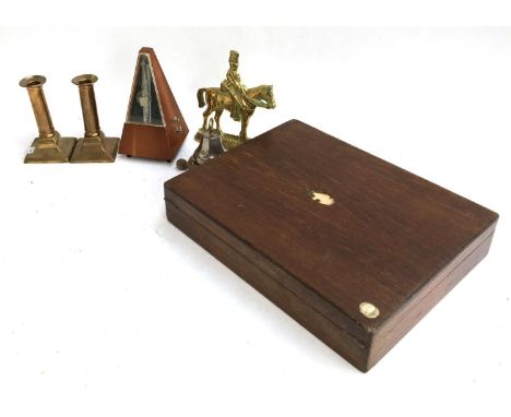 A mixed lot to include oak canteen (af); mechanical metronome; desk bell; candlesticks; brass doorstop 