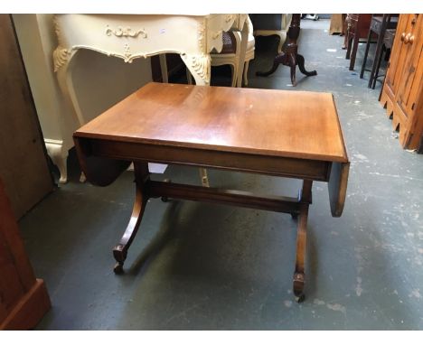 A small mahogany sofa table, on brass casters, 70cmW 