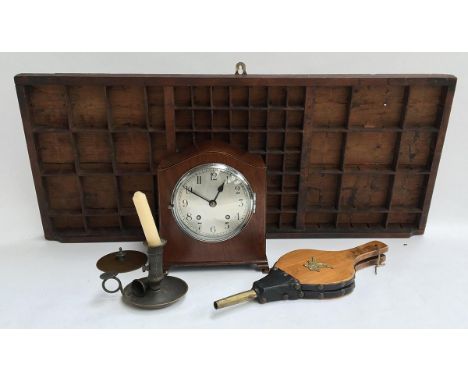 A mahogany cased mantel clock with key; together with a small set of fire bellows; candlestick with snuffer and a compositors