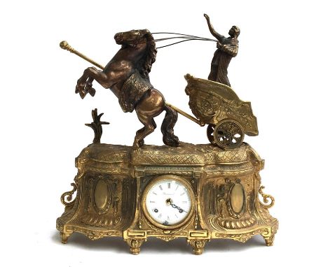 A German brass mantel clock, surmounted by Boudica in a horse drawn chariot, movement by 'FHS Germany', 51cmH 