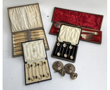 A cased set of six silver coffee bean terminal coffee spoons by Mappin &amp; Webb, together with a further set of plated coff