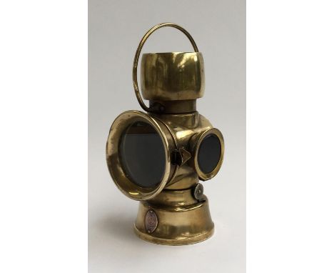 A brass Lucas Ltd. Birmingham 'King of the Road' car lamp, copper plaque reading '636' 