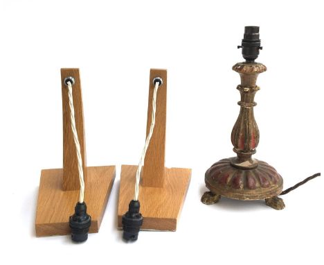 Two contemporary oak wall lights; together with a 19th century carved wood and gesso table lamp 