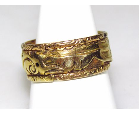 A poison ring, raised with a repeat hunting scene decoration, with scrolls, dogs and fox, with inner compartment, size V, unm