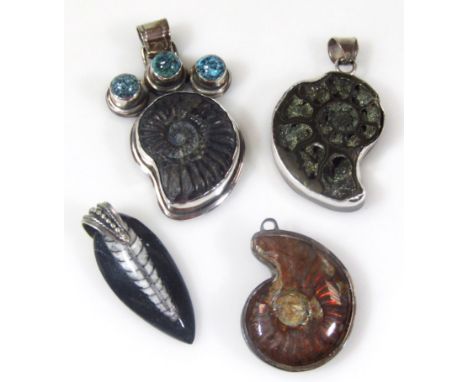 Four fossil necklaces, to include an enclosed shell in silver mount, a pendant set with ammonite and three green/blue stones,