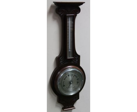 A 20thC two dial barometer and thermometer, in carved cased, 70cm high.
