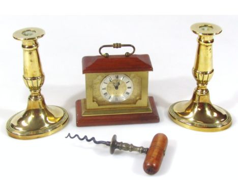 A brass and wooden head corkscrew, in the manner of Matthew Boulton, 17cm high, a pair of brass candlesticks and a mantel clo