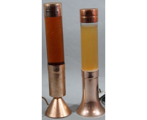 A retro lava lamp, of cylindrical outline with metal mounts and amber coloured centre, 48cm high, with modern electrical fitt