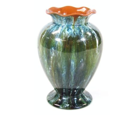 A Linthorpe Studio pottery vase, with flared floral rim, shouldered circular body and circular foot, decorated in splash deco