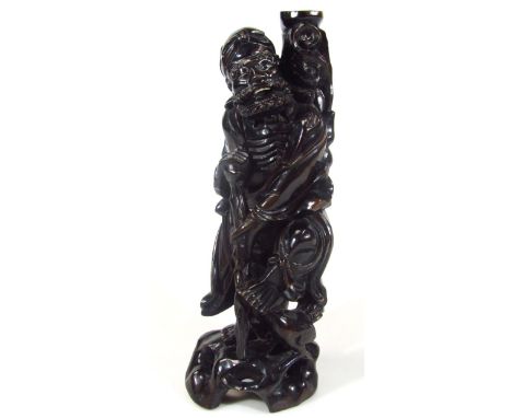 An early 20thC Japanese root carving lamp base, formed as a bearded sage holding staff on pierced naturalistic base, 45cm hig