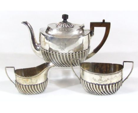 A Victorian harlequin silver three piece tea service, comprising teapot, 18cm high, two handled sugar bowl and milk jug each 