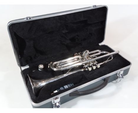 A Berkeley three button chrome coloured trumpet, in fitted case, 50cm wide.