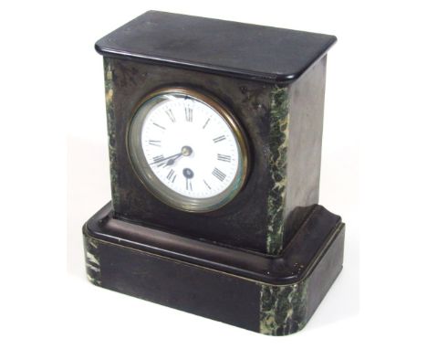 A Victorian black slate mantel clock, with 10cm dia. Roman numeric dial revealing a key wind movement with pendulum.