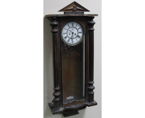 A late 19thC Gustav Becker walnut cased Vienna wall clock, the 18cm dia. dial with Roman numerals revealing an eight day key 