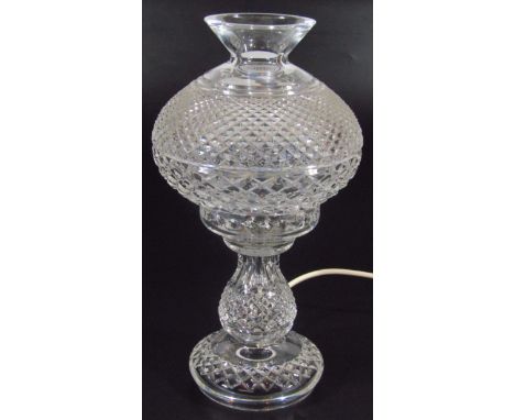 A 20thC Waterford crystal table lamp, with (removable) shade and a hobnail cut banding on an inverted stem with electrical fi